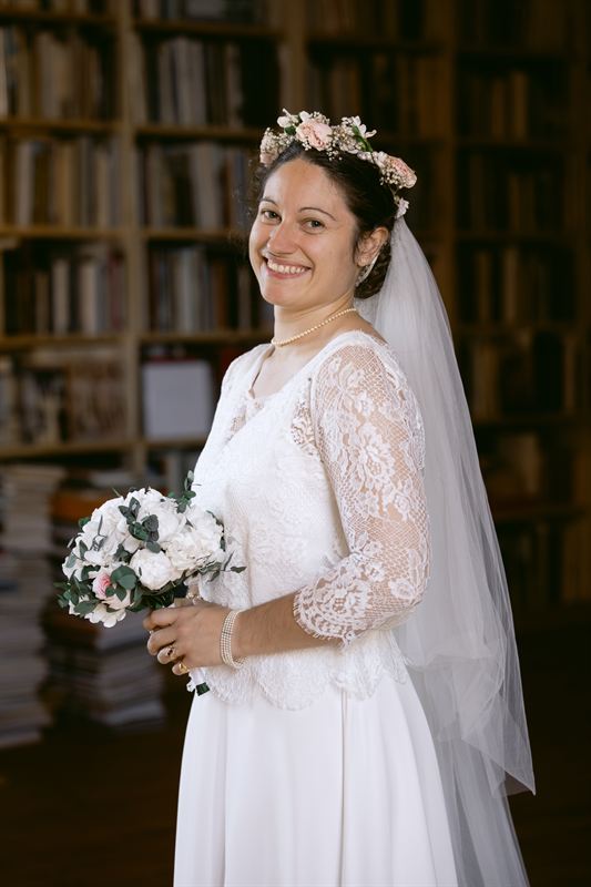 Portrait of the bride in the library, lace gown